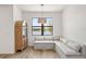 Cozy nook with bench seating, lake view and stylish lighting fixture at 2563 Ocean Breeze Ln, Clearwater, FL 33761