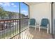 Screened-in balcony with outdoor seating area and views of the neighborhood at 2595 Countryside Blvd # 8205, Clearwater, FL 33761