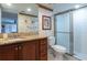Bathroom features granite counters, a shower, and tiled walls with decorative wallpaper at 2595 Countryside Blvd # 8205, Clearwater, FL 33761