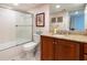 Well-maintained bathroom with walk-in shower, granite countertop, and stylish fixtures at 2595 Countryside Blvd # 8205, Clearwater, FL 33761