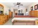 Large bedroom with dressers, comfortable bed, and ensuite bathroom access at 2595 Countryside Blvd # 8205, Clearwater, FL 33761