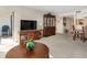 Spacious living room with entertainment center, large china cabinet, and comfortable seating at 2595 Countryside Blvd # 8205, Clearwater, FL 33761