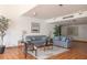 Bright living room featuring cozy seating and a stylish area rug on a tile floor at 2595 Countryside Blvd # 8205, Clearwater, FL 33761