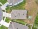 Overhead view showcasing a home's roof, yard, driveway, and surrounding property lines at 32775 Brooks Hawk Ln, Wesley Chapel, FL 33543