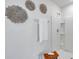A modern walk-in shower with a white towel in the bathroom at 32775 Brooks Hawk Ln, Wesley Chapel, FL 33543