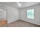Cozy bedroom with a ceiling fan and a window at 32775 Brooks Hawk Ln, Wesley Chapel, FL 33543
