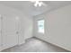 Bright bedroom featuring a window, ceiling fan and carpeted floors at 32775 Brooks Hawk Ln, Wesley Chapel, FL 33543