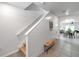 Bright hallway with shiplap walls, wooden bench, and tiled floors at 32775 Brooks Hawk Ln, Wesley Chapel, FL 33543
