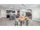 Spacious eat-in kitchen featuring an island and adjacent dining area, perfect for entertaining at 32775 Brooks Hawk Ln, Wesley Chapel, FL 33543