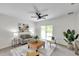 Bright living room with comfortable seating, stylish decor, and a view of the backyard at 32775 Brooks Hawk Ln, Wesley Chapel, FL 33543