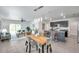 Open-concept living space with a dining table, kitchen, and comfortable seating arrangement at 32775 Brooks Hawk Ln, Wesley Chapel, FL 33543