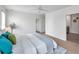 Comfortable bedroom with hardwood floors, a ceiling fan, and an ensuite bathroom at 32775 Brooks Hawk Ln, Wesley Chapel, FL 33543