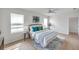 Serene bedroom featuring white walls, wood floors, and a calming color palette at 32775 Brooks Hawk Ln, Wesley Chapel, FL 33543