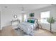 Bright bedroom with a ceiling fan, ample natural light, and neutral décor at 32775 Brooks Hawk Ln, Wesley Chapel, FL 33543