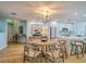 Cozy dining area featuring a round table, stylish chairs, modern lighting, and seamless kitchen access at 331 Cleveland St # 1806, Clearwater, FL 33755