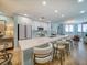 Bright kitchen with a spacious island, modern appliances, ample cabinetry, and barstool seating at 331 Cleveland St # 1806, Clearwater, FL 33755