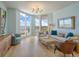 Elegant living room boasts large windows with stunning views, comfortable seating, and stylish lighting at 331 Cleveland St # 1806, Clearwater, FL 33755