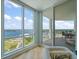 Bright living room with amazing bay views from floor-to-ceiling windows and access to a private balcony at 331 Cleveland St # 1806, Clearwater, FL 33755