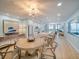 Open-concept living space showcases a dining area, kitchen with bar seating, and a cozy living area at 331 Cleveland St # 1806, Clearwater, FL 33755
