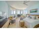 The main bedroom boasts floor-to-ceiling windows with balcony access, a ceiling fan, and stunning water views at 331 Cleveland St # 1806, Clearwater, FL 33755