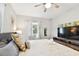 Comfortable bedroom featuring ceiling fan, window, decorative pillows and wall art at 3626 17Th N St, St Petersburg, FL 33713