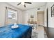 Bedroom with window, ceiling fan, simple vanity and white terrazzo floor at 3626 17Th N St, St Petersburg, FL 33713