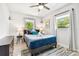 This bright bedroom features two windows, ceiling fan and simple decoration at 3626 17Th N St, St Petersburg, FL 33713