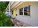 Close-up of the bright yellow front door and brick walkway of this delightful home at 3626 17Th N St, St Petersburg, FL 33713