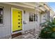 Close-up of bright yellow front door and stylish mailbox of this lovely home at 3626 17Th N St, St Petersburg, FL 33713
