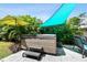 Backyard featuring a hot tub surrounded by lush landscaping and a shade sail at 3626 17Th N St, St Petersburg, FL 33713