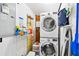 Laundry room featuring a stacked washer and dryer, storage shelves and work space at 3626 17Th N St, St Petersburg, FL 33713