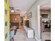 Inviting living room with wood accent wall, ceiling fan, and view of the kitchen at 3626 17Th N St, St Petersburg, FL 33713