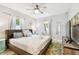 A bright main bedroom featuring stylish decor, a ceiling fan, and lots of light at 3626 17Th N St, St Petersburg, FL 33713