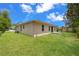 Expansive backyard with lush green grass, offering plenty of space for recreation and entertaining at 3803 E Curtis St, Tampa, FL 33610
