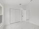 Bedroom featuring a closet and large window providing natural light to the home at 3803 E Curtis St, Tampa, FL 33610