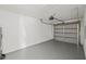 A clean, painted garage with a new garage door and motor at 3803 E Curtis St, Tampa, FL 33610