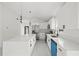Contemporary kitchen with an island, stainless steel appliances, and modern pendant lights at 3803 E Curtis St, Tampa, FL 33610