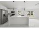 Modern kitchen featuring an island, stainless steel appliances, and recessed lighting at 3803 E Curtis St, Tampa, FL 33610