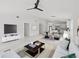 Spacious living area with an open layout, seamlessly connecting the living and dining spaces at 3803 E Curtis St, Tampa, FL 33610