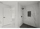 Modern shower with black and white marble-style tile, a niche, and black fixtures at 3803 E Curtis St, Tampa, FL 33610