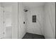 Modern shower with black and white marble-style tile, a niche, and black fixtures at 3803 E Curtis St, Tampa, FL 33610