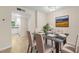Dining room with glass table and views to the kitchen creating an open flow at 381 S Mcmullen Booth Rd # 72, Clearwater, FL 33759