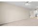 Spacious living room with neutral carpet and lots of natural light adjacent to the kitchen at 381 S Mcmullen Booth Rd # 72, Clearwater, FL 33759