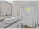 Bathroom featuring a modern vanity with a vessel sink and white subway tile, a serene and updated space at 3906 N Ola Ave, Tampa, FL 33603