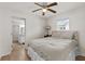 Cozy bedroom with a ceiling fan, warm natural light, and an open bathroom view, a peaceful and intimate retreat at 3906 N Ola Ave, Tampa, FL 33603