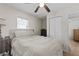 Cozy bedroom featuring a ceiling fan, closet, and natural light streaming through the window at 3906 N Ola Ave, Tampa, FL 33603