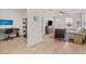 Inviting living room features light wood floors, a ceiling fan, and ample natural light at 3906 N Ola Ave, Tampa, FL 33603