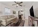 Cozy living area filled with natural light, neutral-toned furniture, and wood-look flooring at 3906 N Ola Ave, Tampa, FL 33603