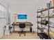 Bright office with a desk, bookshelves, and fishing equipment setup in a cozy, well-lit space at 3906 N Ola Ave, Tampa, FL 33603