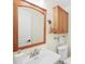 Bathroom vanity with white sink and wood framed mirror at 430 44Th Ne Ave, St Petersburg, FL 33703